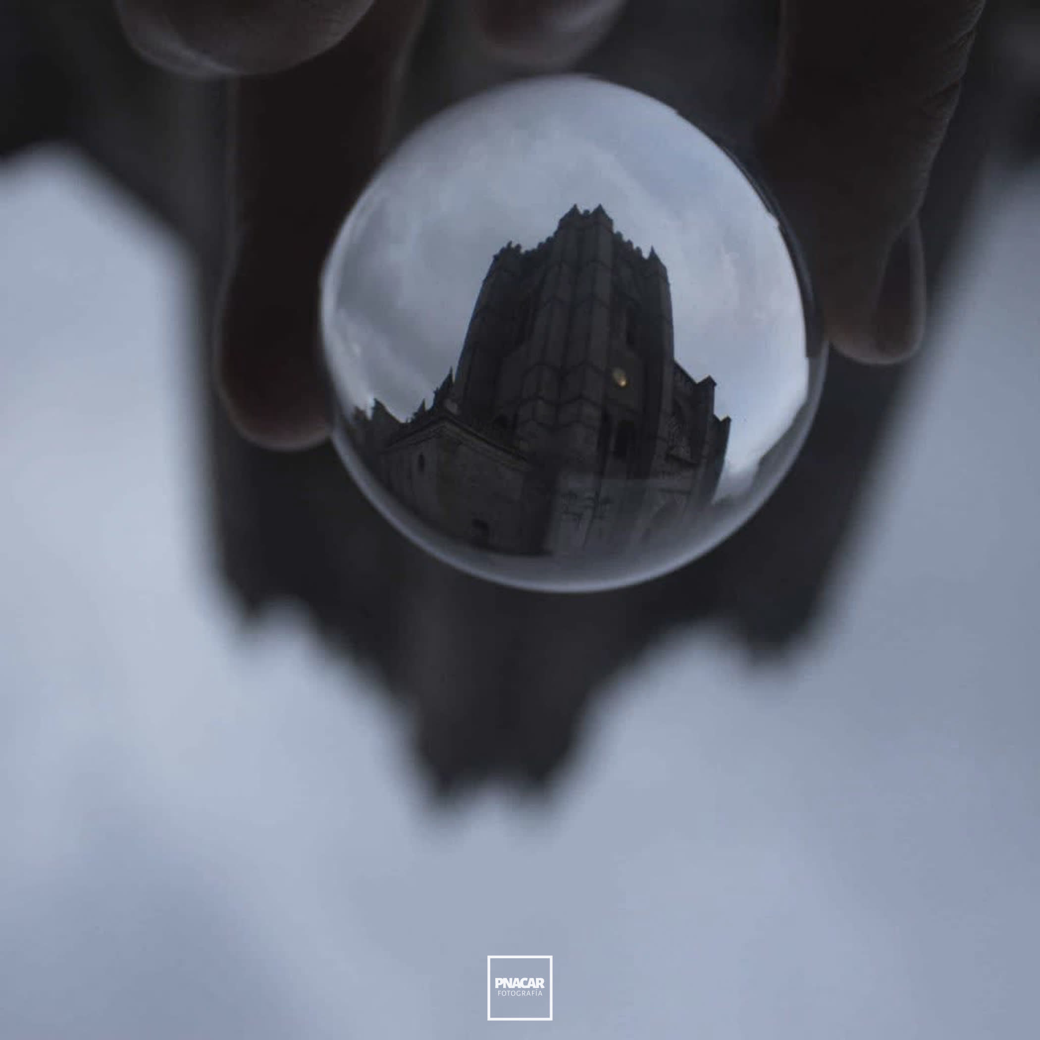 Tower of the Cathedral of Avila through a glass ball 