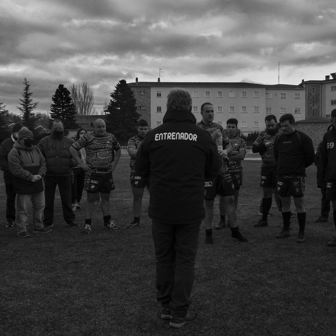  Coach Motivates Rugby Team During Outdoor Training Session in Overcast Weather. (c) pmartinasi
