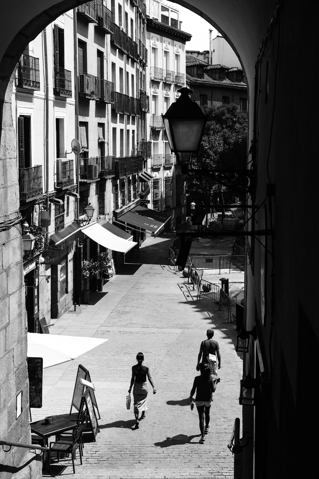  Summer street scene at Puerta de Cuchilleros steps leading to Plaza Mayor in Madrid, Spain. (c) pmartinasi