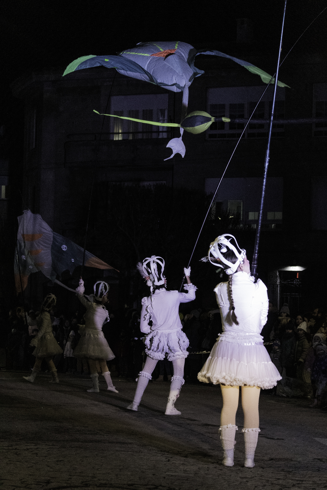  Night scene of performers dressed in white costumes during the Three Wise Men Parade 2026 in Ávila, Spain, as they move through the streets before a gathered crowd, highlighting the festive, artistic and cultural spirit of Epiphany. January 2026. (c) pmartinasi