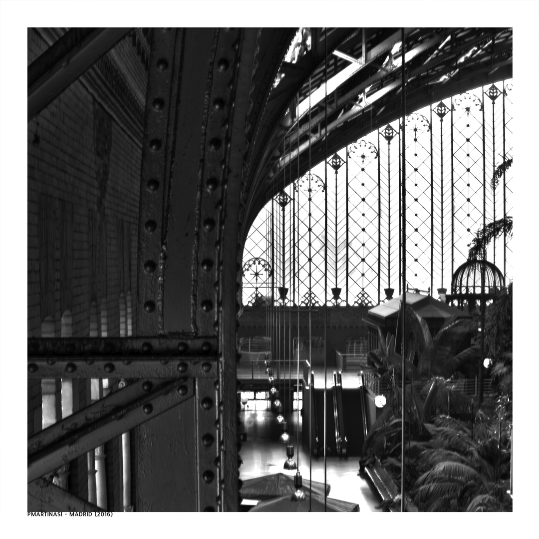  Classic black and white photo of the iconic Puerta del Sol Metro sign with the historic clock tower behind, capturing the spirit of central Madrid and its architectural charm. (c) pmartinasi