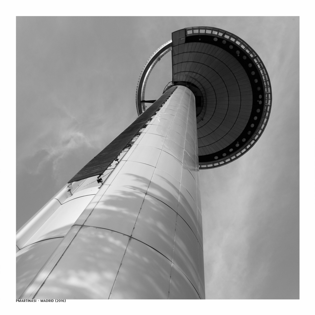  Dramatic black and white view of Faro de Moncloa tower reaching skyward through architectural harmony and urban stillness, highlighting its iconic presence in the heart of Madrid. (c) pmartinasi