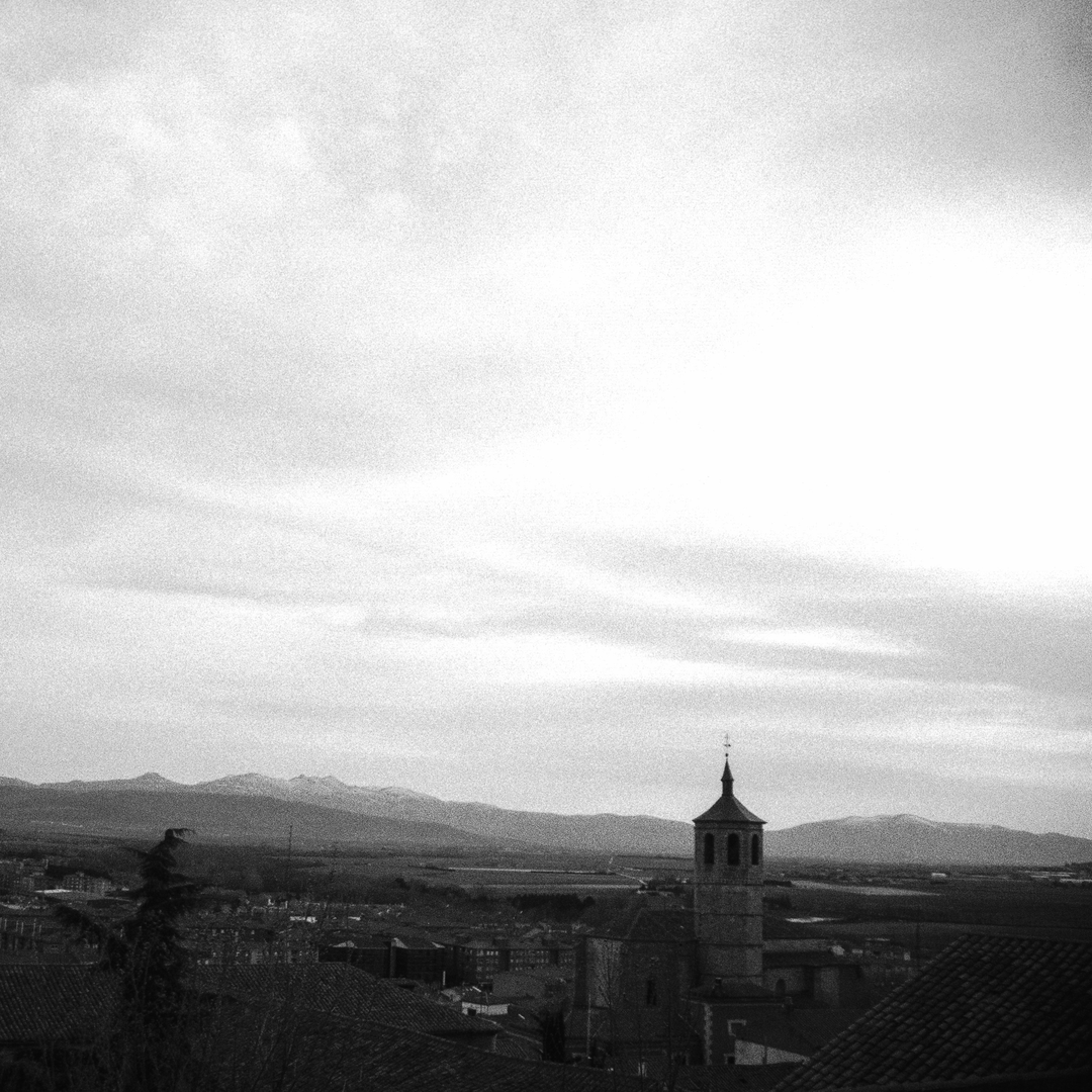  Panoramic view of the southern part of Ávila, dominated by the unmistakable bell tower of the Church of Santiago, in Ávila, Spain. (c) pmartinasi