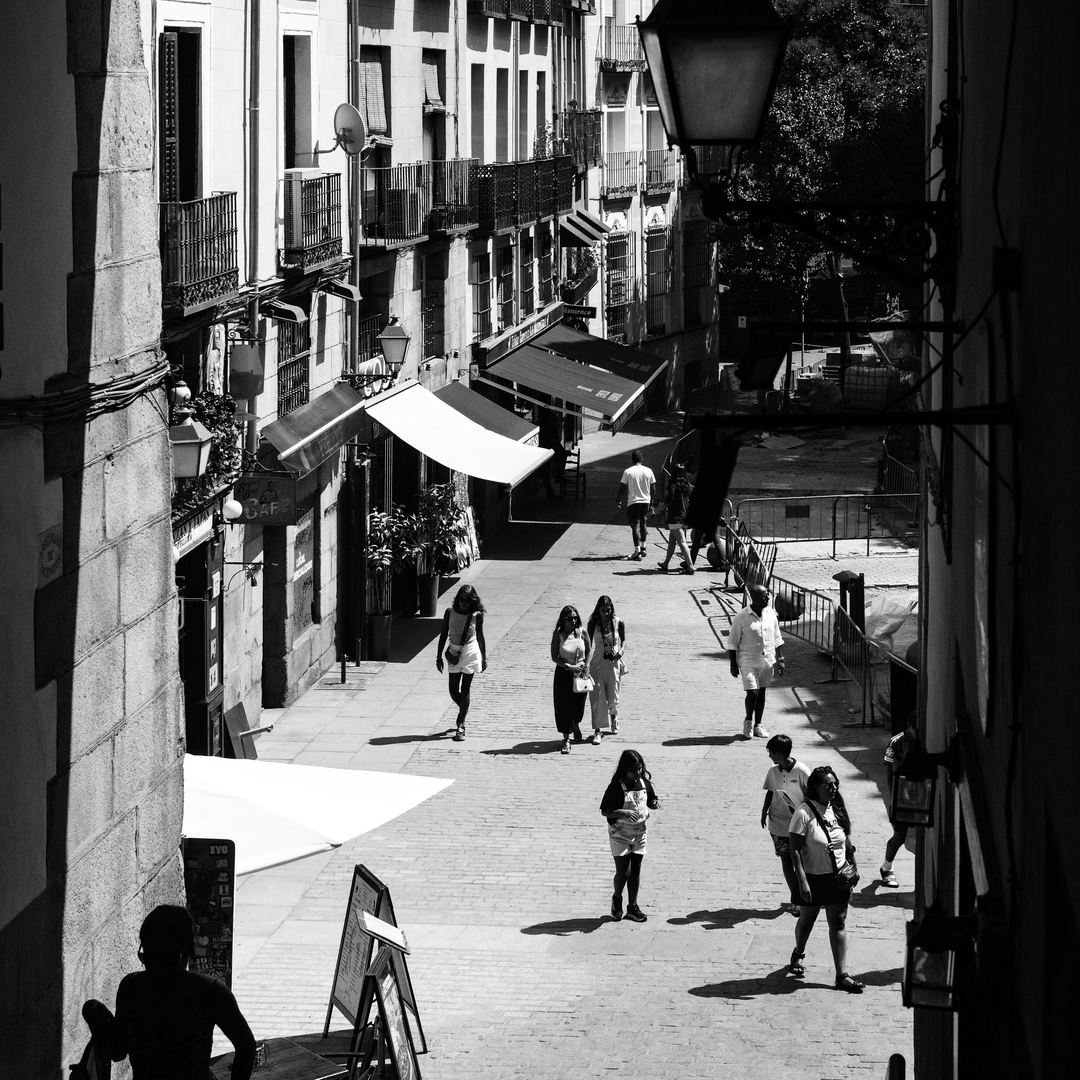  Summer street scene at Puerta de Cuchilleros steps leading to Plaza Mayor in Madrid, Spain. (c) pmartinasi