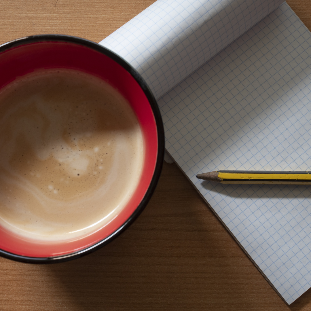  Morning Productivity Setup with Coffee and Blank Notebook on Wooden Table. (c) pmartinasi