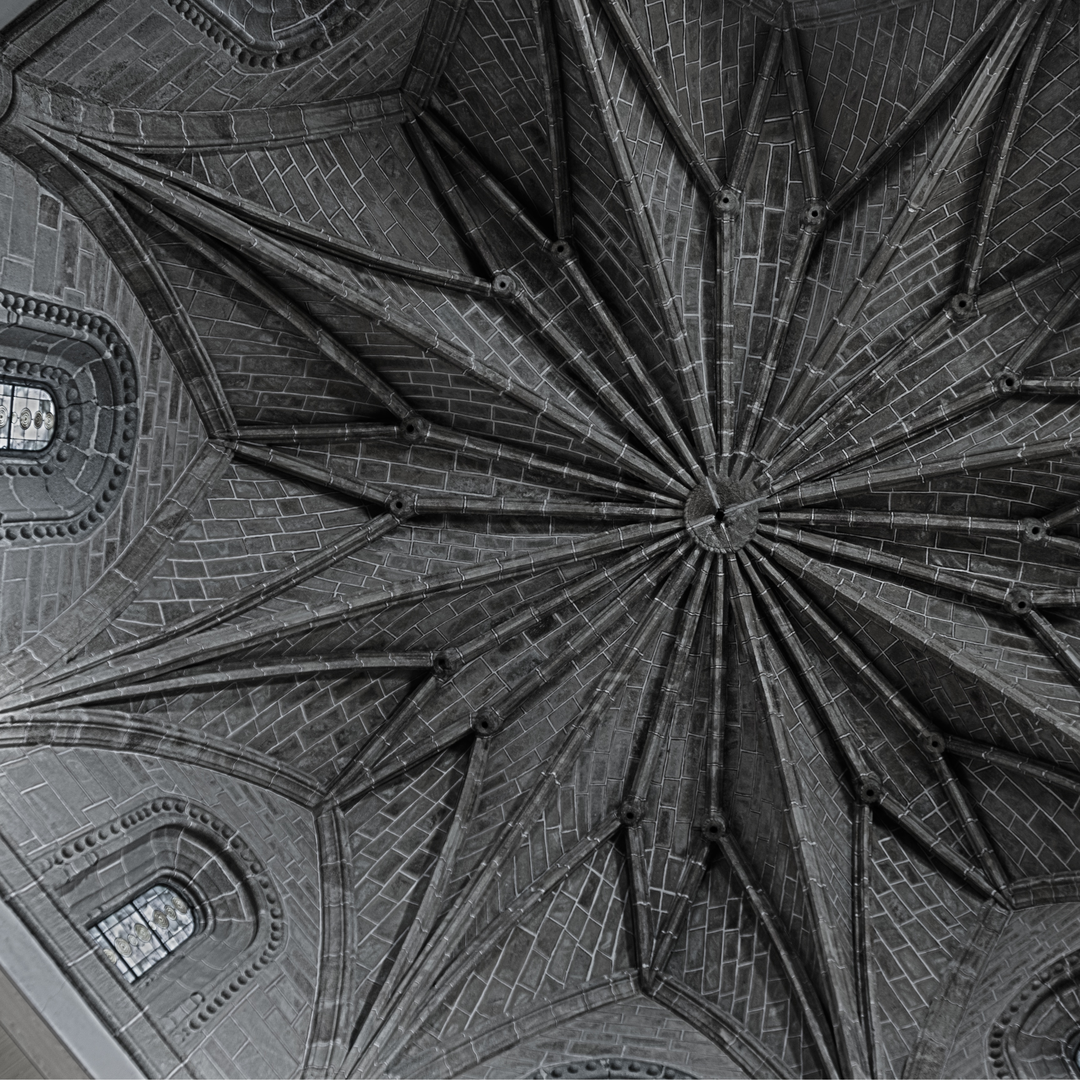 Detailed view of a Gothic-style ribbed vault ceiling with radial design in the Church of San Francisco in Ávila, Spain. The image captures the architectural craftsmanship and symmetry of medieval stone masonry. (c) pmartinasi