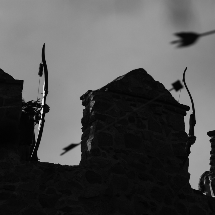  Archers shooting on the historic rampart walls of Ávila during the Medieval Fair and Market, evoking heritage and tradition. Medieval Market and Fair at Avila, Spain. September 2025. (c) pmartinasi