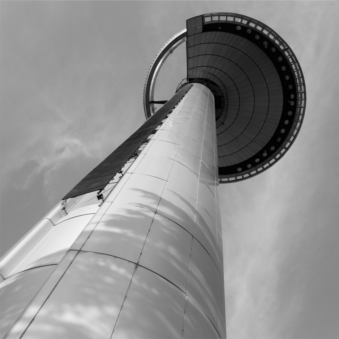  Dramatic black and white view of Faro de Moncloa tower reaching skyward through architectural harmony and urban stillness, highlighting its iconic presence in the heart of Madrid. (c) pmartinasi